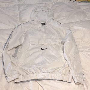 White, black and yellow quarter zip Nike windbreaker